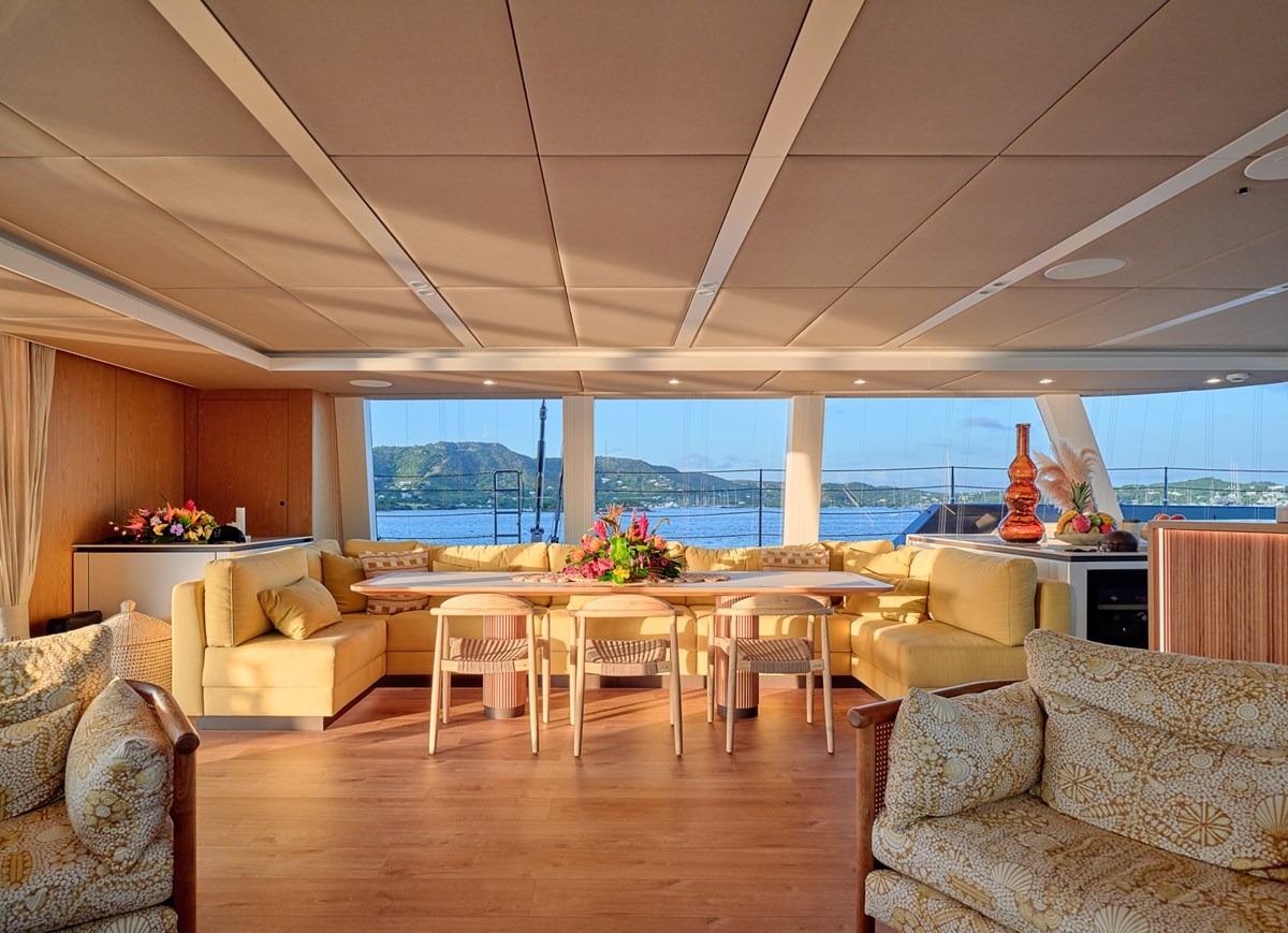 Salon and dining area of the Sunreef 80 with panoramic sea views