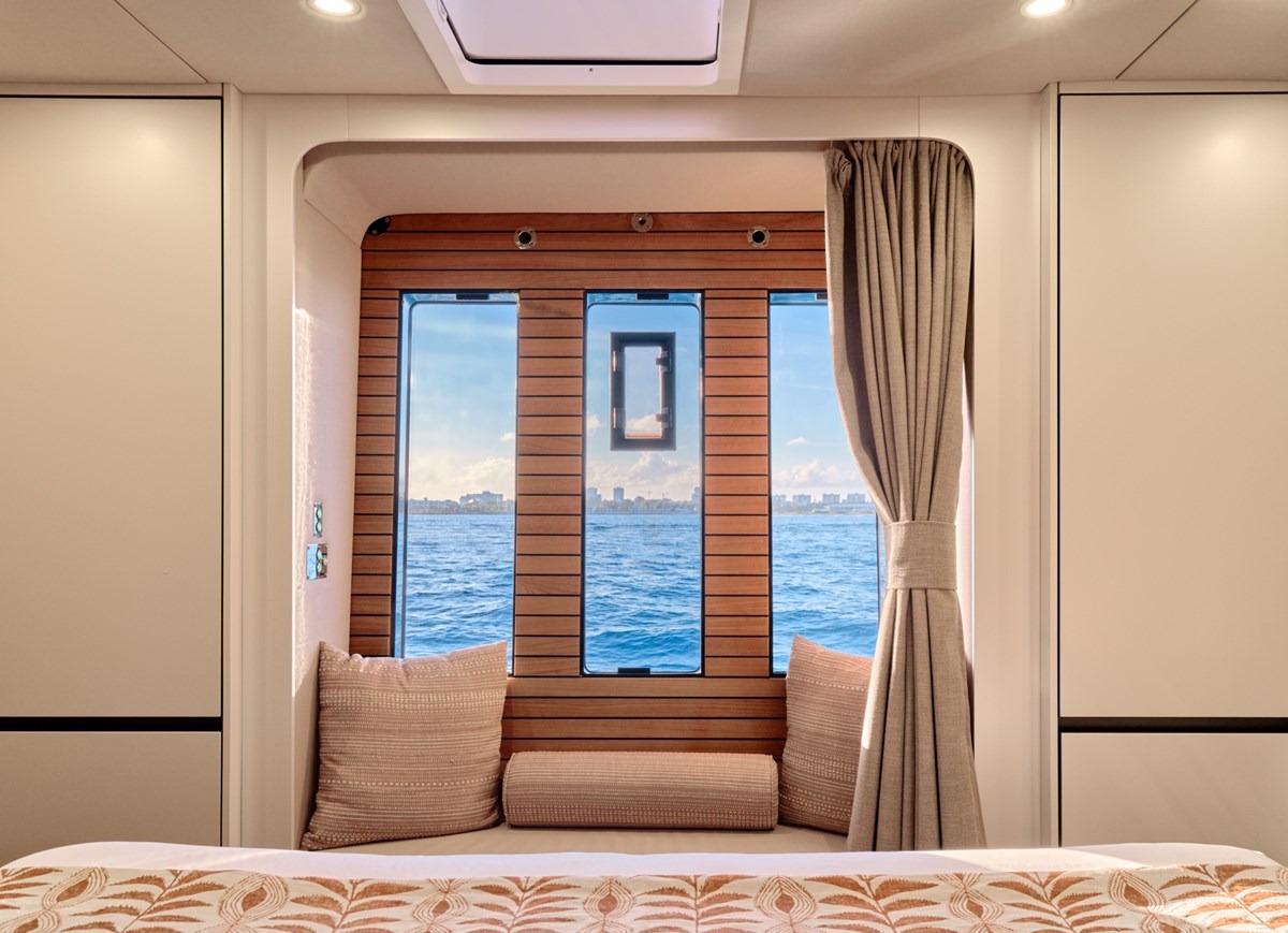 Cabin window seat of the Sunreef 80 with a view over the sea