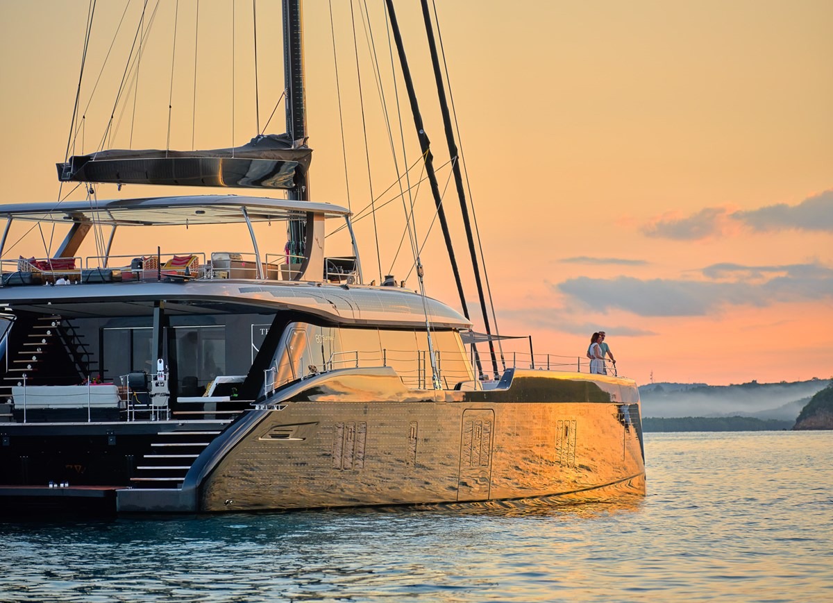 Couple on the bow of the Sunreef 80 at sunset
